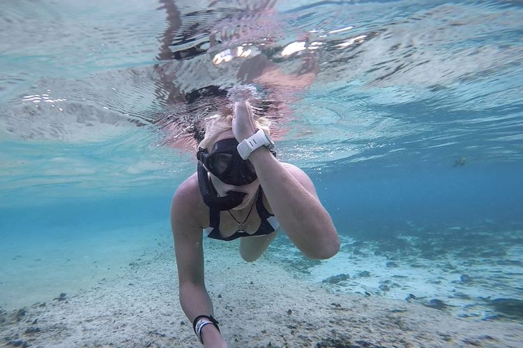 Margo showing the sharks signal underwater.